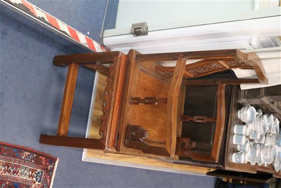 A pair of Chinese carved hardwood elbow chairs